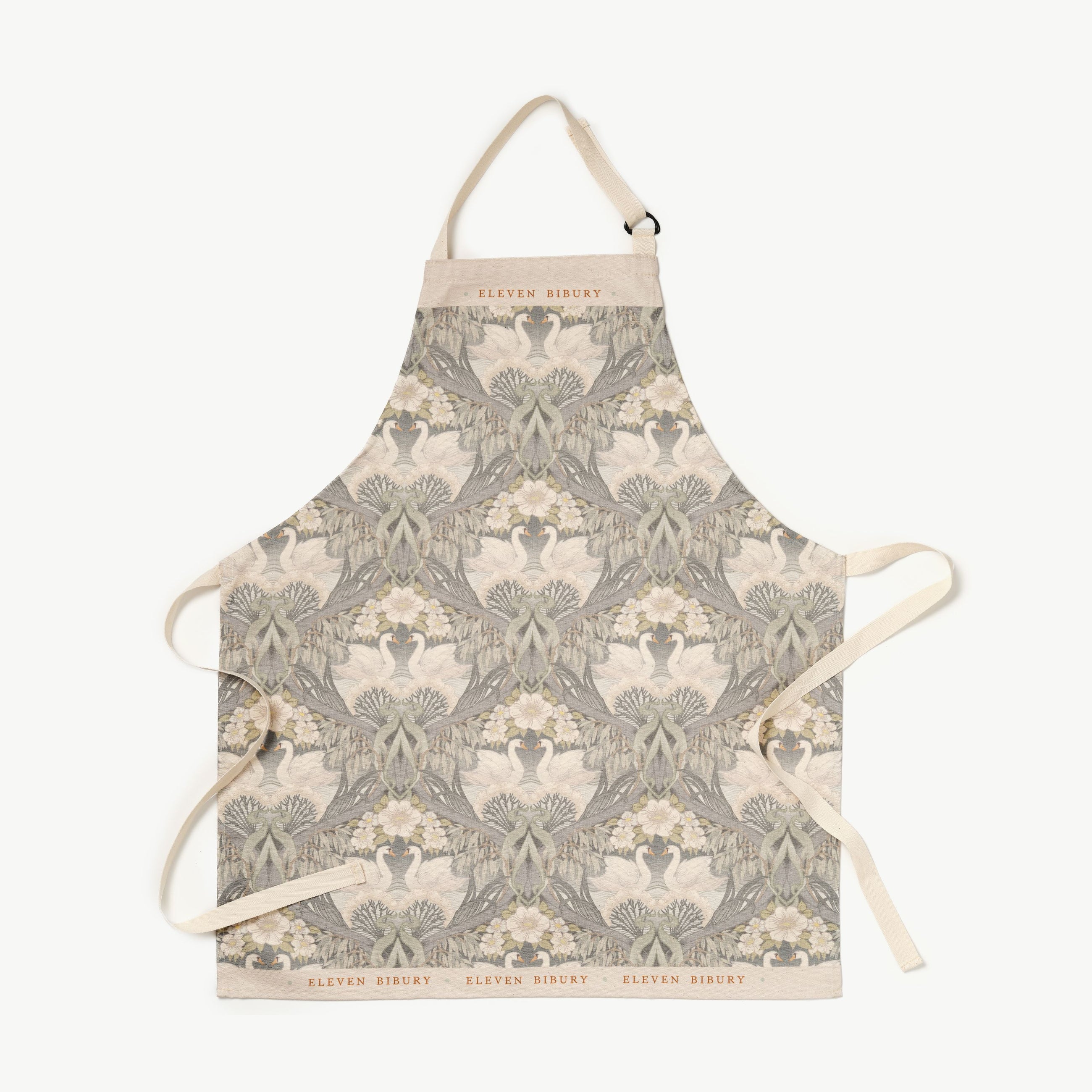 Bibury Swan patterned apron with Eleven Bibury logo on a white background