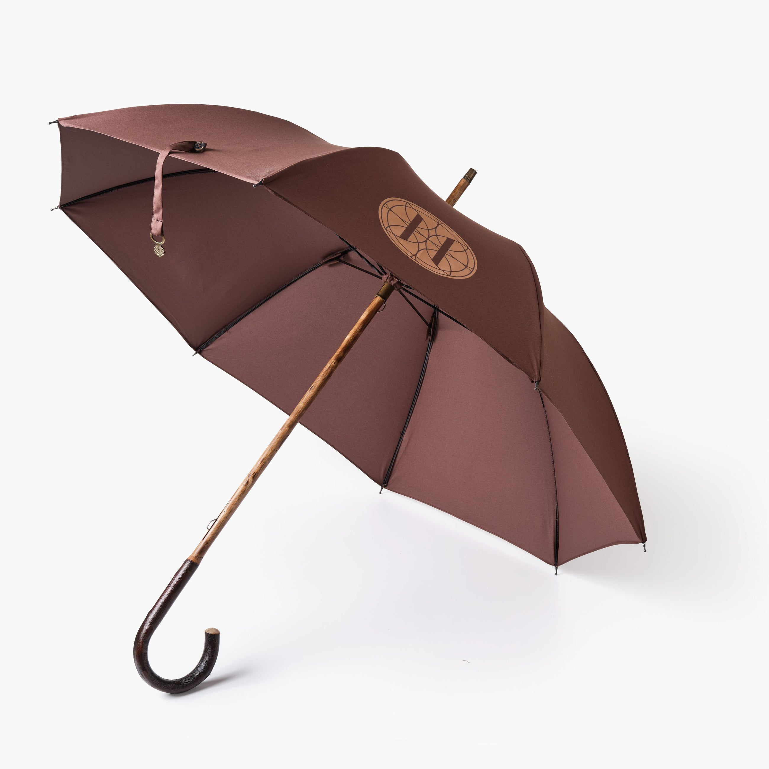 Brown umbrella open with Eleven Bibury logo