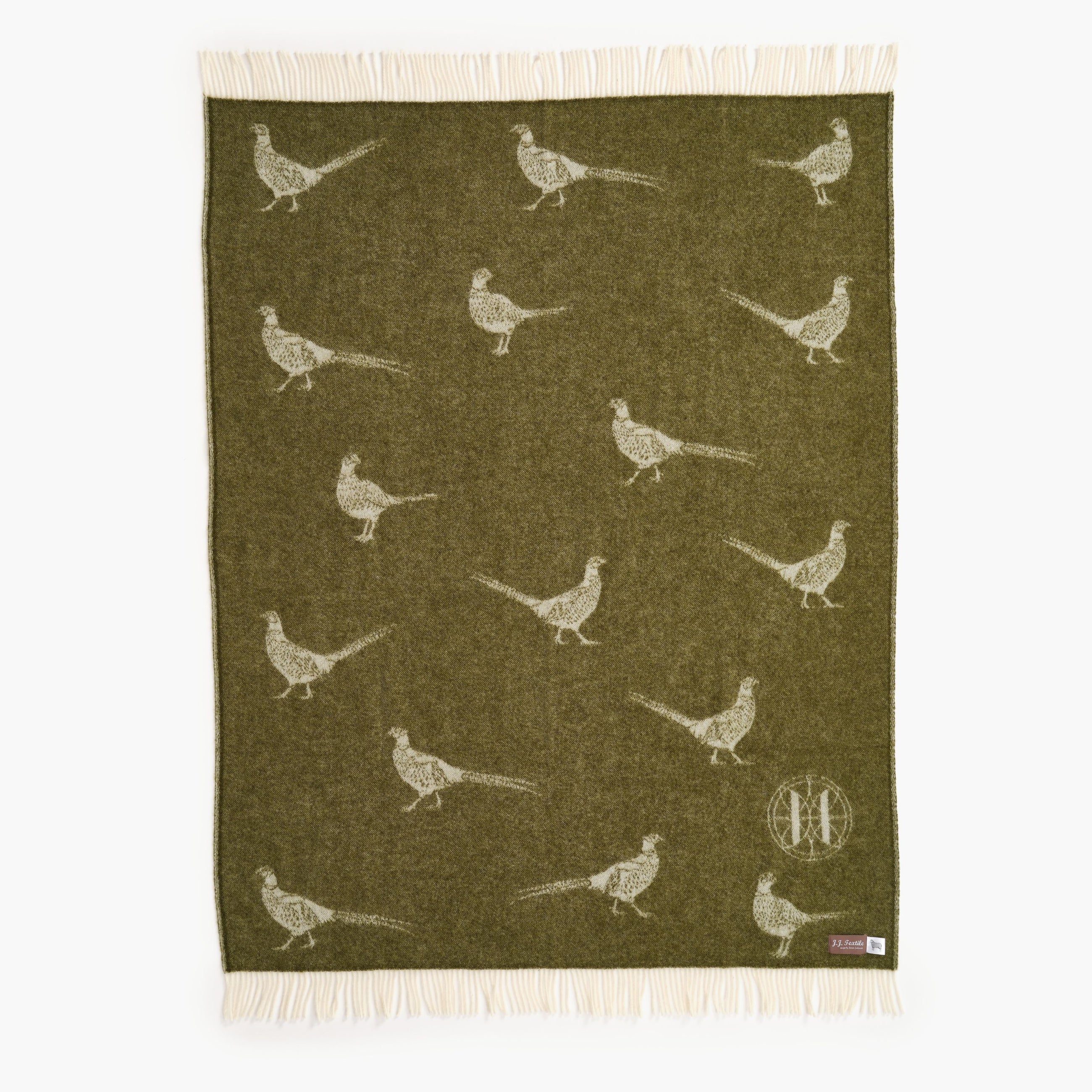 Green throw with pheasant pattern on a white background