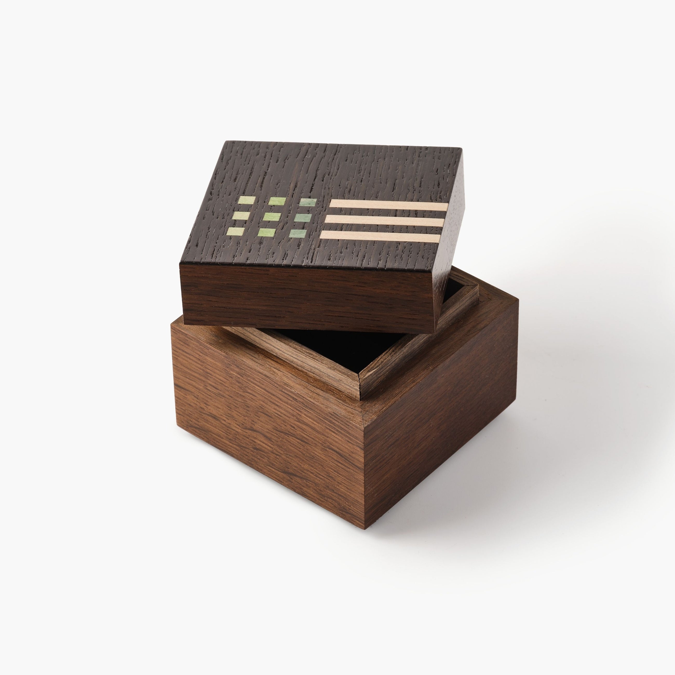 Wooden box with geometric patterns on a white background