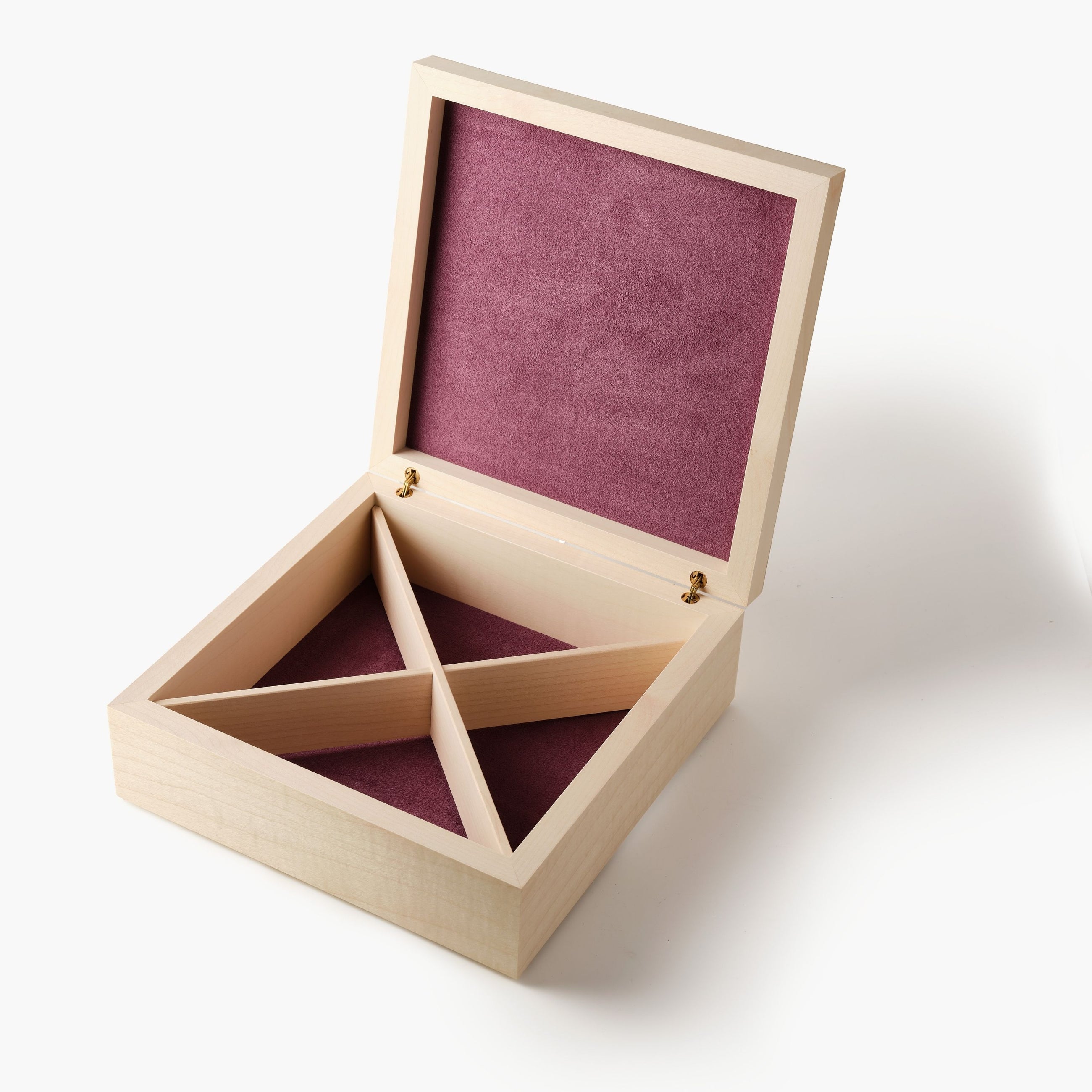Wooden jewelry box with a purple interior on a white background