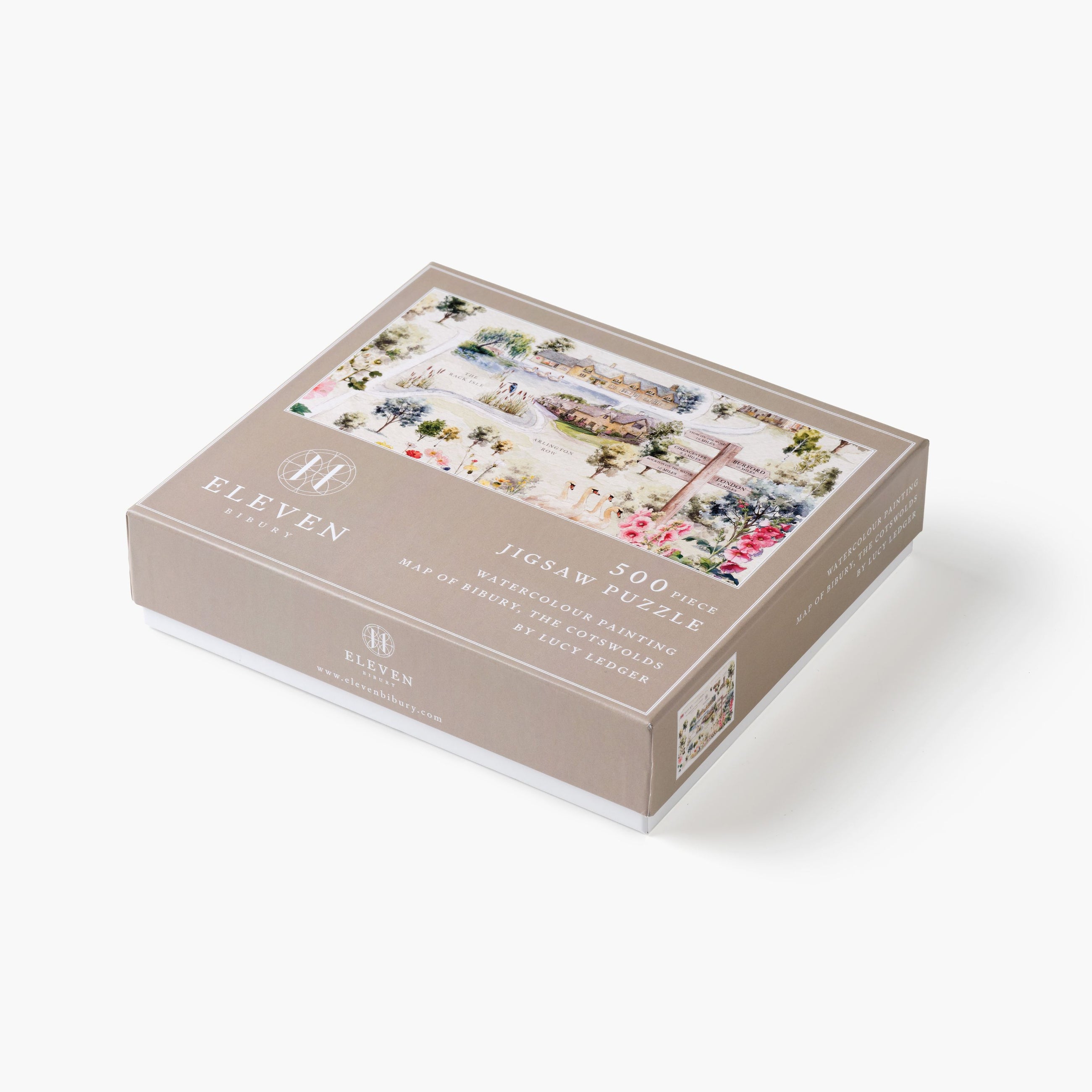 Jigsaw puzzle box with scenic illustrations on a white background