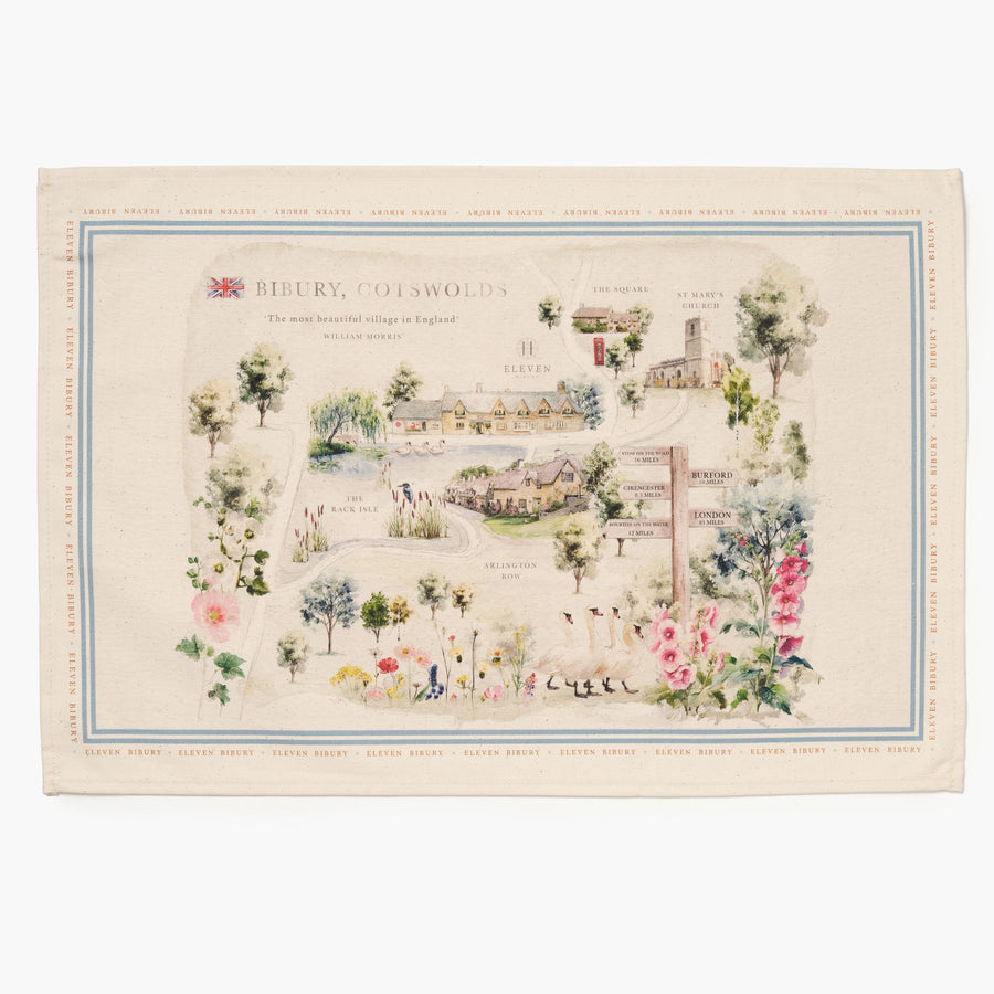 Cotton tea towel with illustration of a map of Bibury, Cotswolds with illustrations and text on a white background