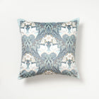 Decorative velvet cushion with floral and swan 'bibury swan' pattern on a white background