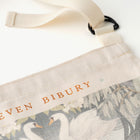 Close up of Bibury Swan designed apron 'Eleven Bibury' text on a white background