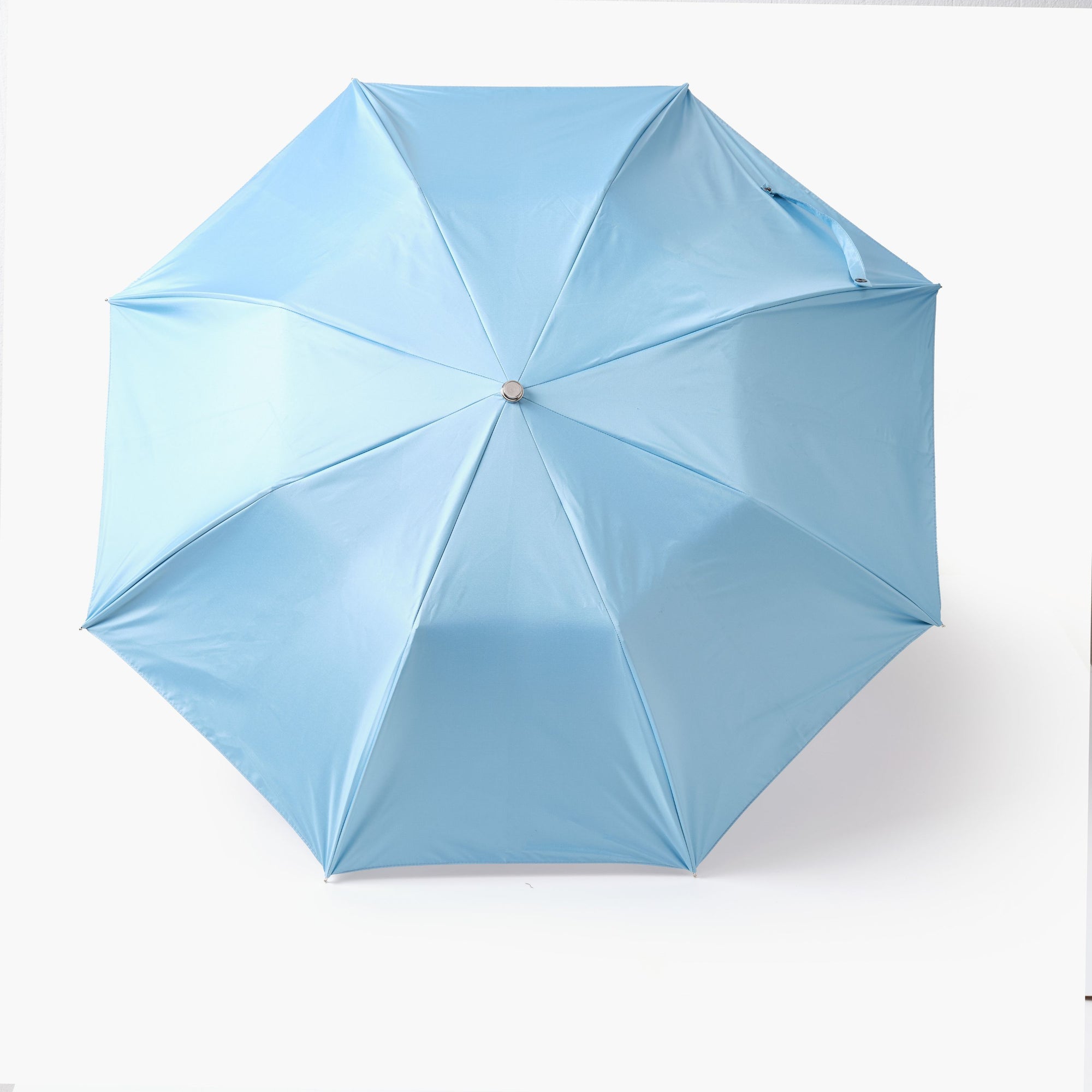 Light blue umbrella on a white background
