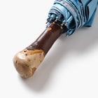 Umbrella with a wooden handle on a white background