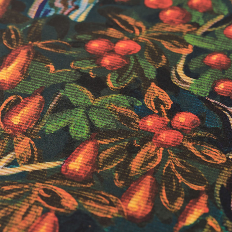 Close-up of a wallpaper with a pattern of leaves and apples on a dark background
