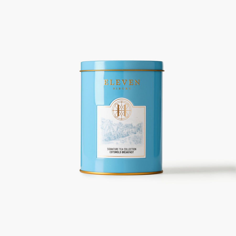 Blue tea canister with 'ELEVEN BIBURY' branding on a white background