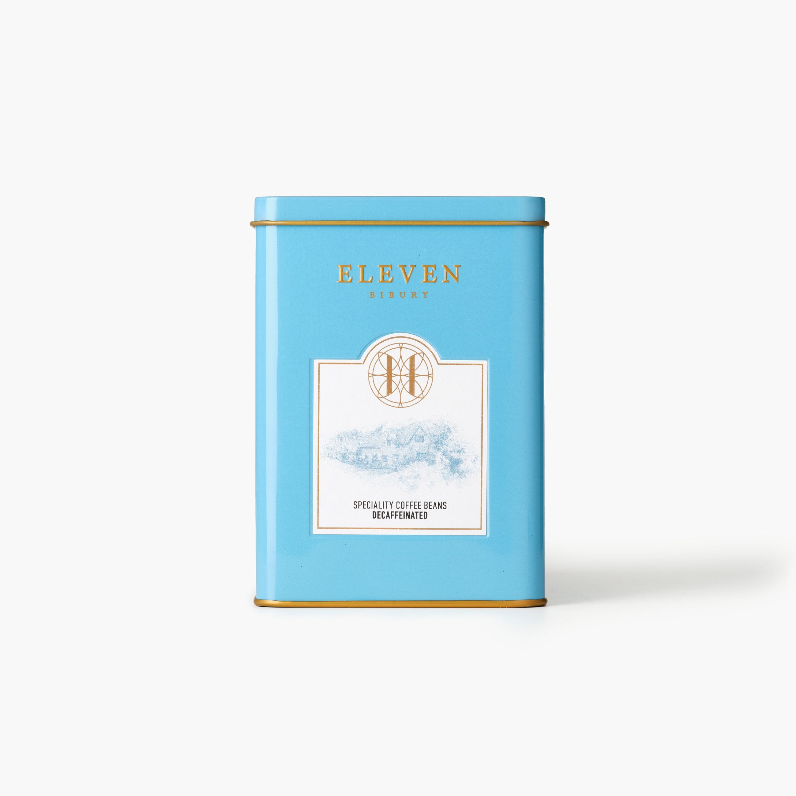 Blue decaf coffee tin with 'Eleven Bibury' branding on a white background