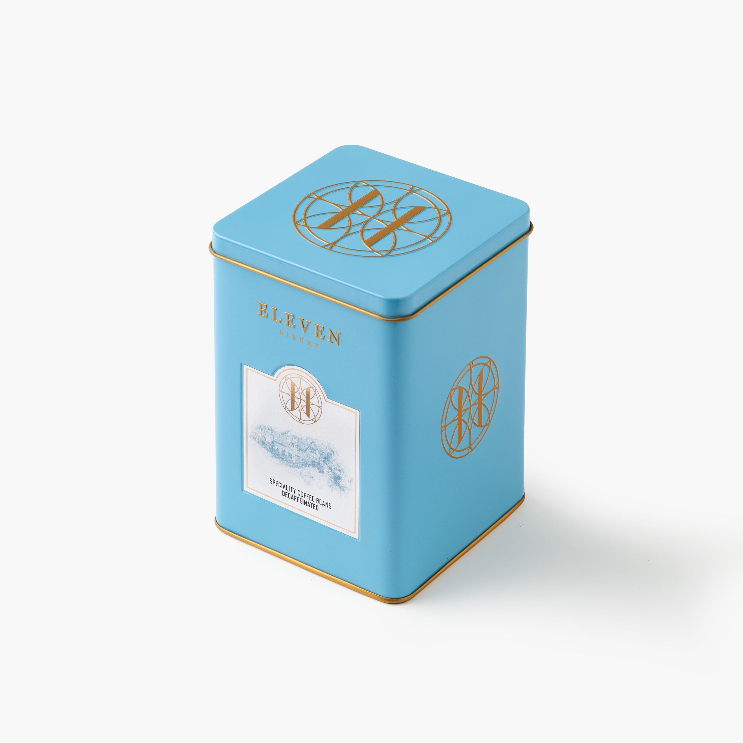 Blue decaf coffee tin with gold accents and 'ELEVEN BIBURY' branding on a white background