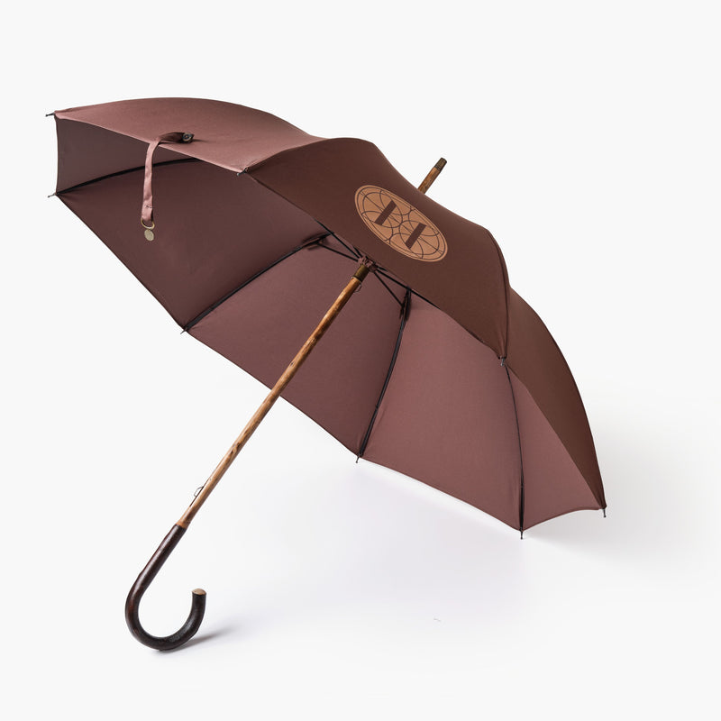 Brown umbrella open with Eleven Bibury logo