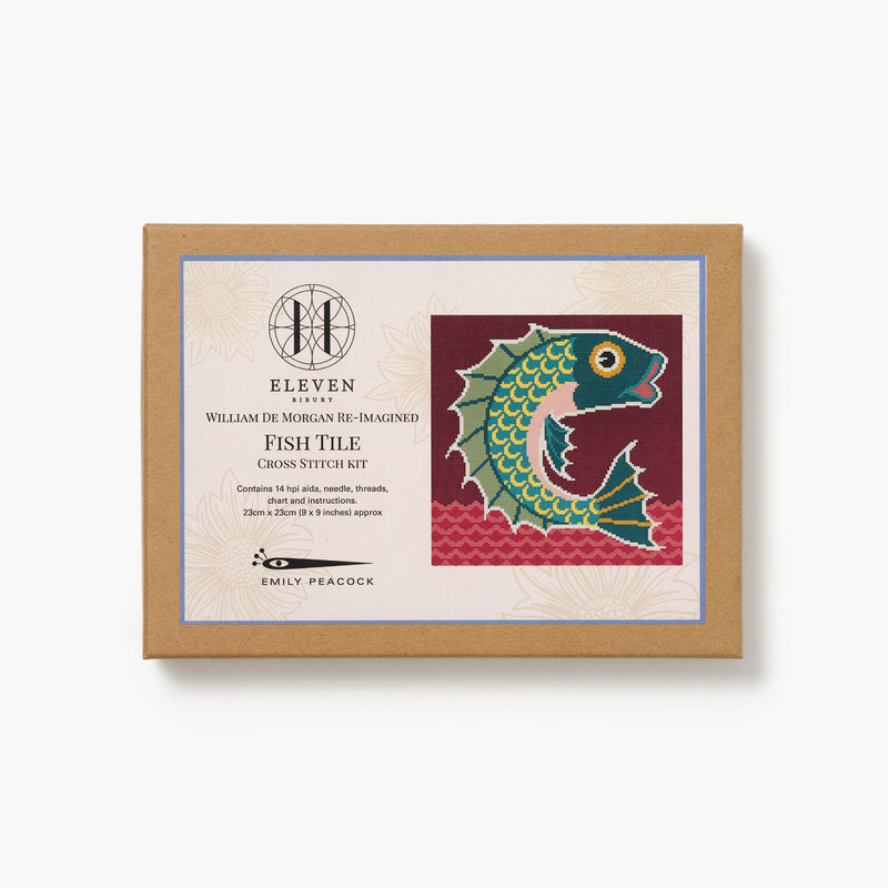 Cross stitch kit packaging with fish design on a white background