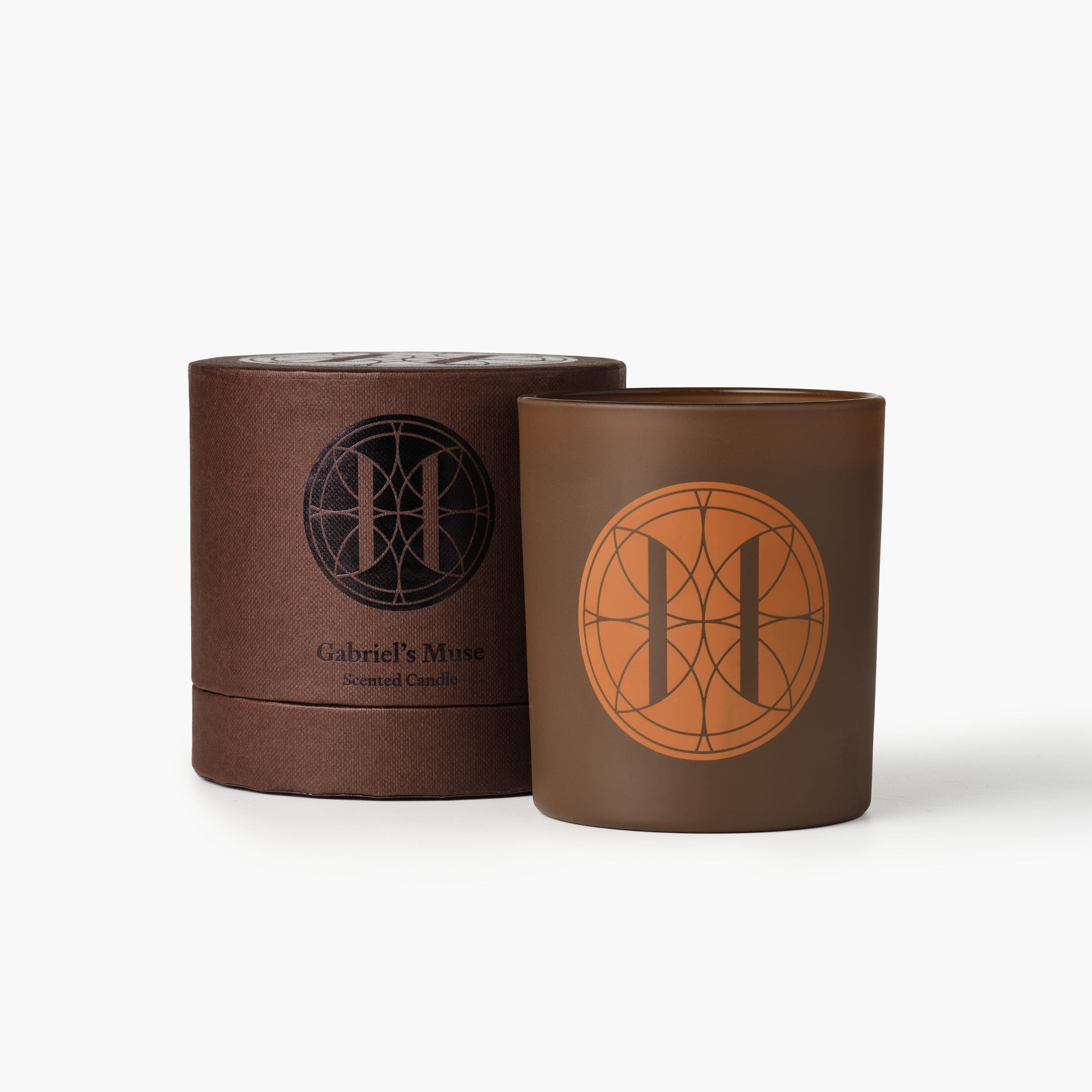 Eleven Bibury 'Gabriel's Muse' brown candle and packaging with 'Gabriel's Muse' branding on a white background