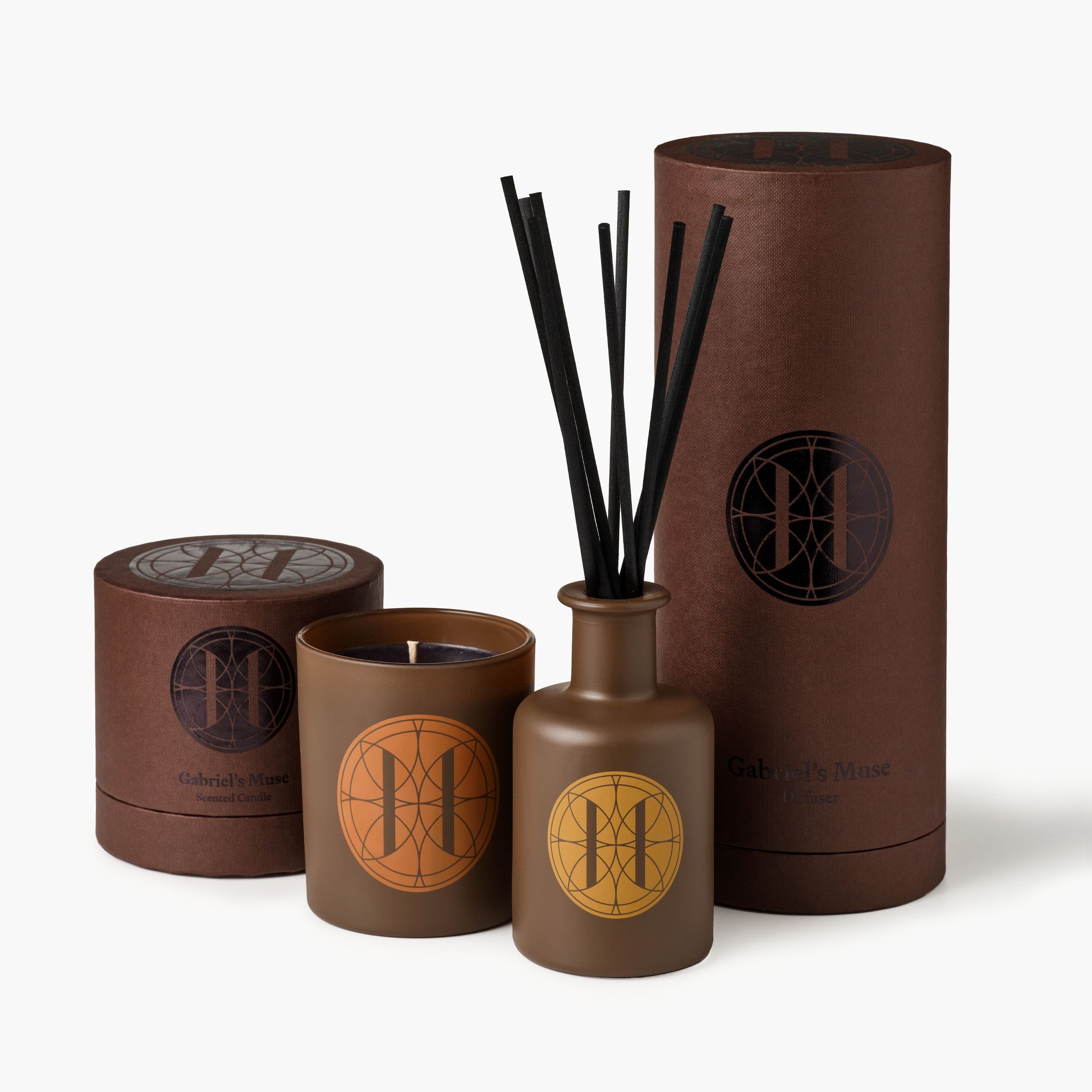 Eleven Bibury 'Gabriel's Muse' brown candle and diffuser with decorative packaging on a white background