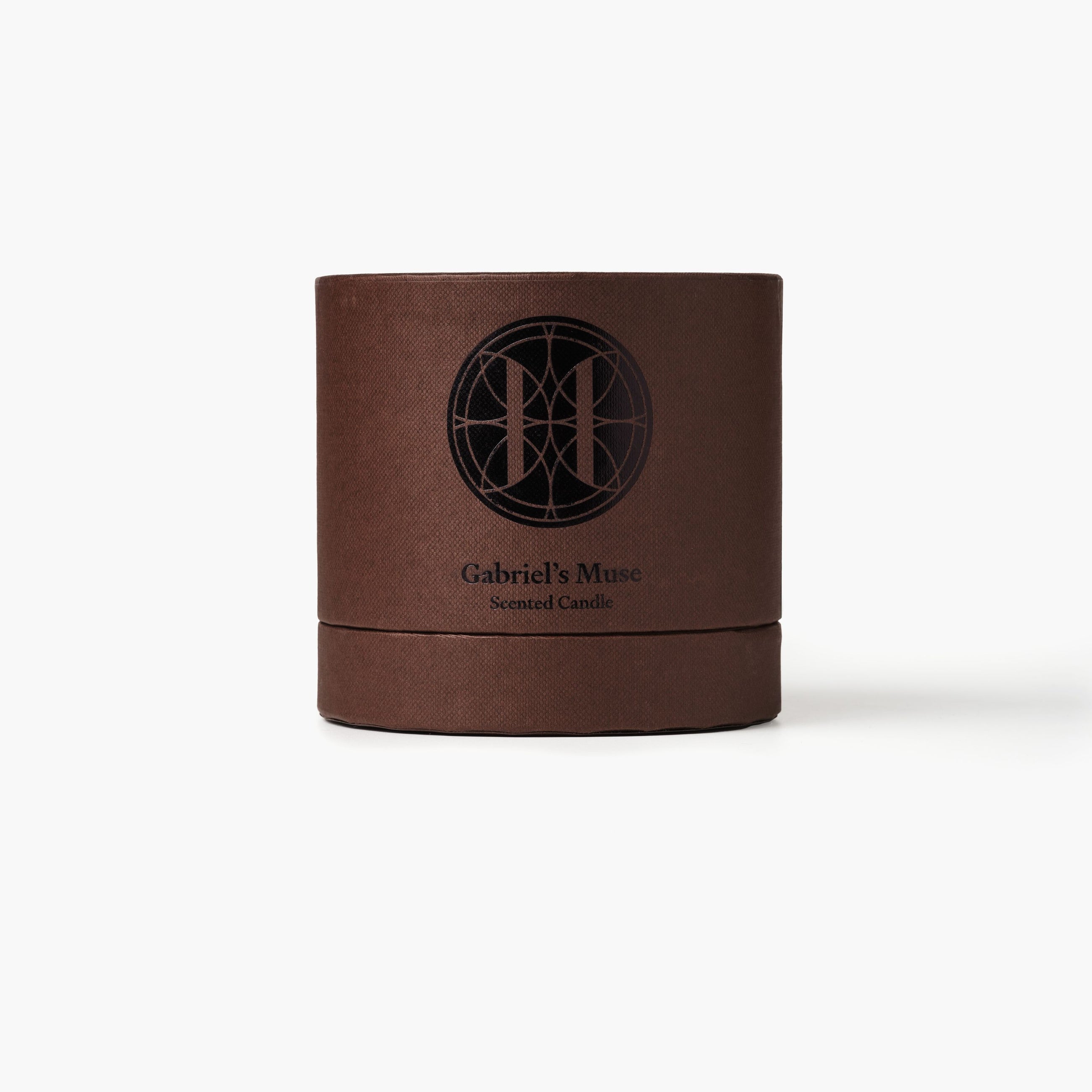 Eleven Bibury 'Gabriel's Muse' brown candle container with 'Gabriel's Muse' branding on a white background