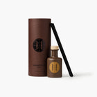 Eleven Bibury 'Gabriel's Muse' diffuser with brown cylindrical container and bottle with logo on a white background
