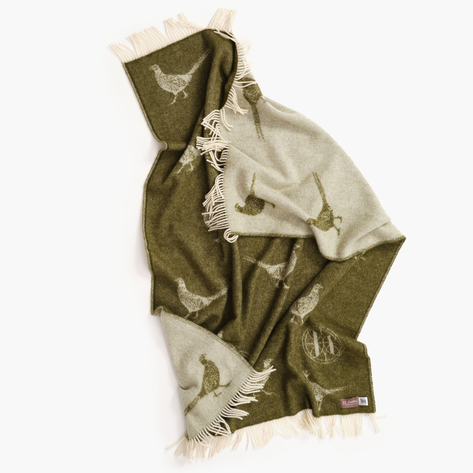 Green and beige patterned pheasant throw with fringe on a white background