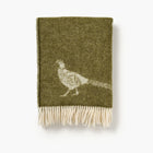 Green blanket with a pheasant design on a white background