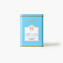 Blue coffee tin with 'Eleven Bibury' branding on a white background