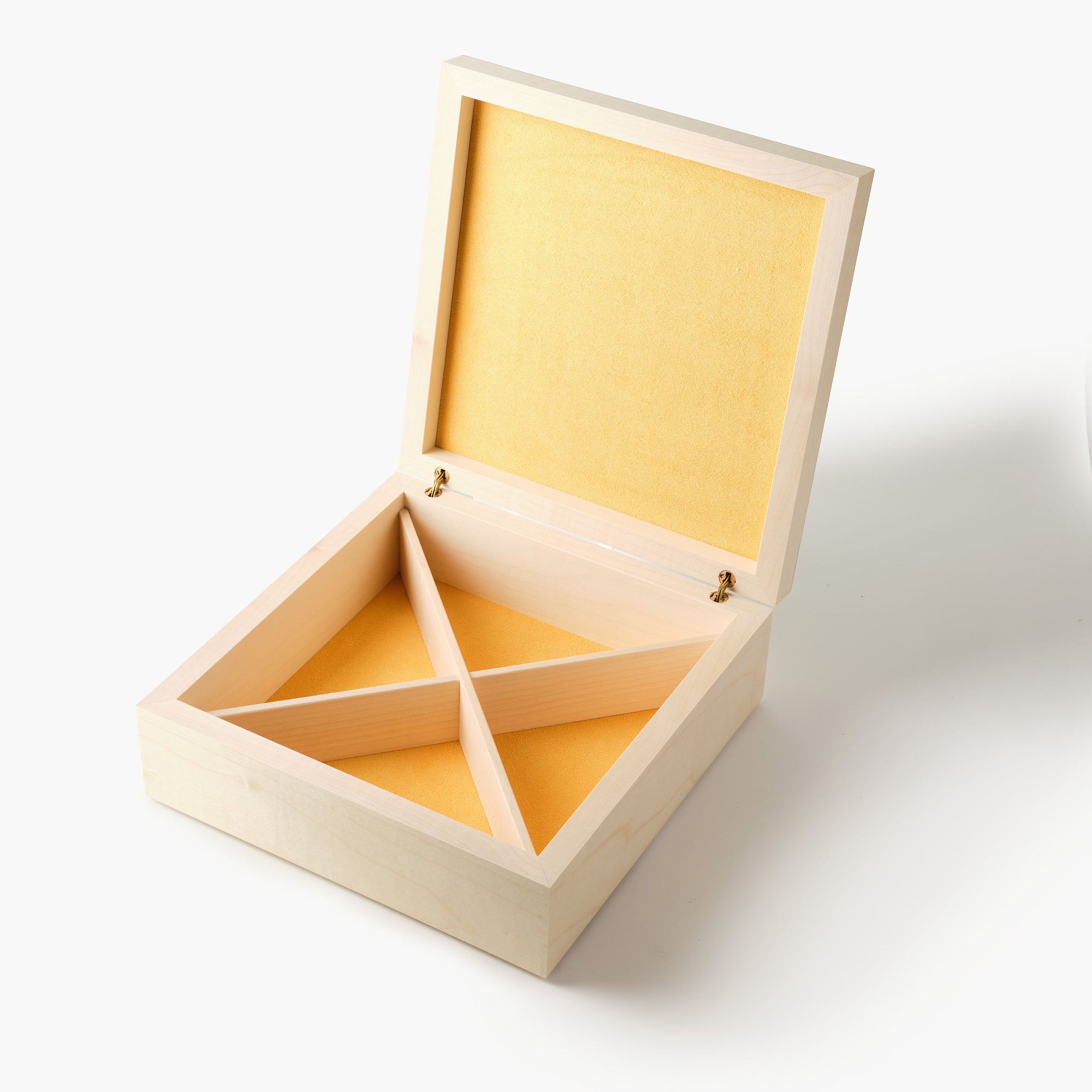 Wooden jewelry box with yellow interior on a white background