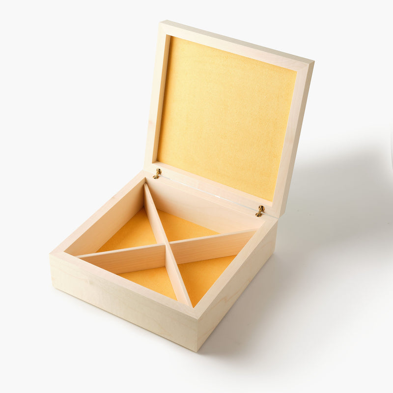 Wooden jewelry box with yellow interior on a white background
