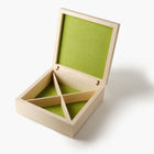 Wooden jewelry box with green interior on a white background