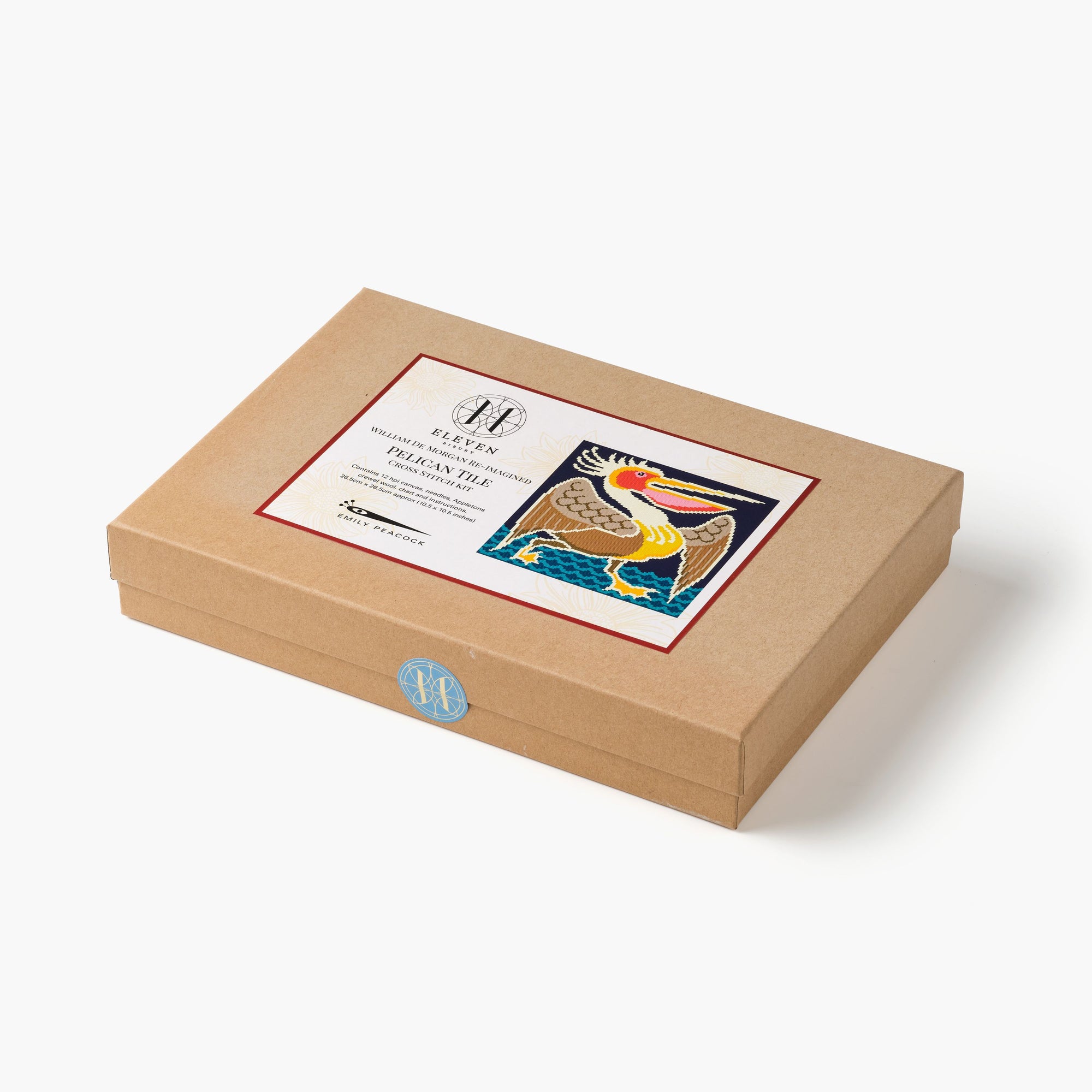 Brown gift box with a decorative label on a white background