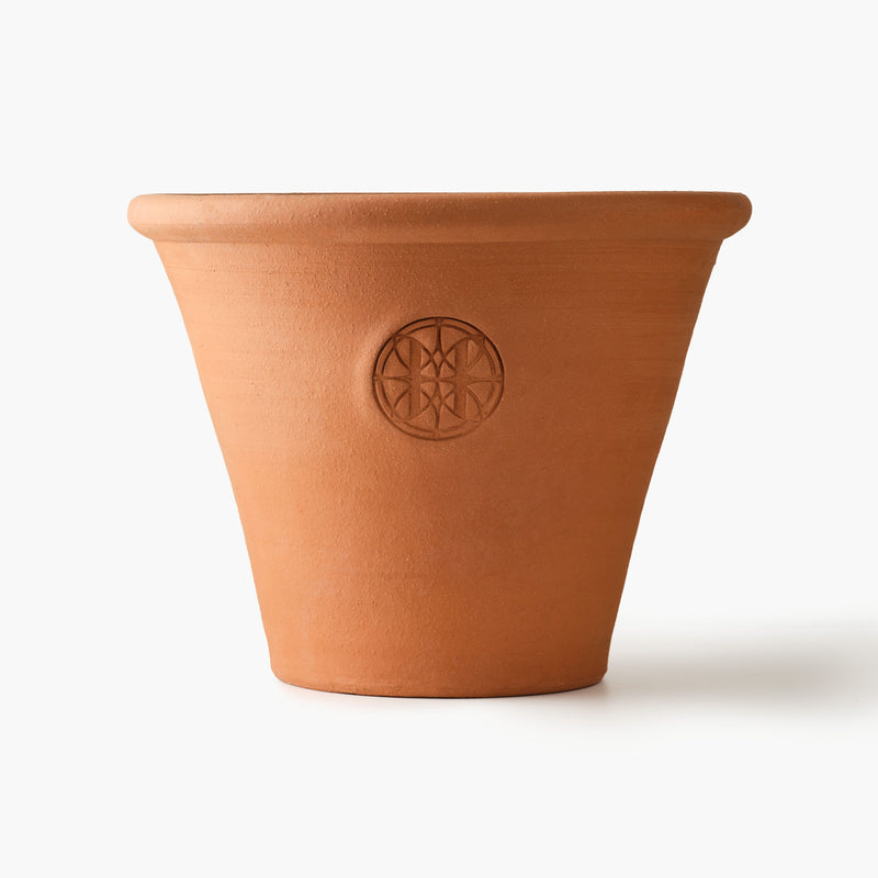 Terracotta pot with a Eleven Bibury logo on a white background