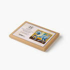 Kraft box with a decorative label featuring a blue horse illustration on a white background