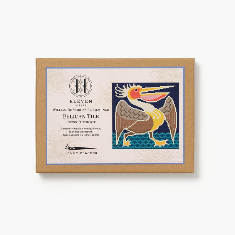 Cross stitch kit packaging with pelican design on a white background