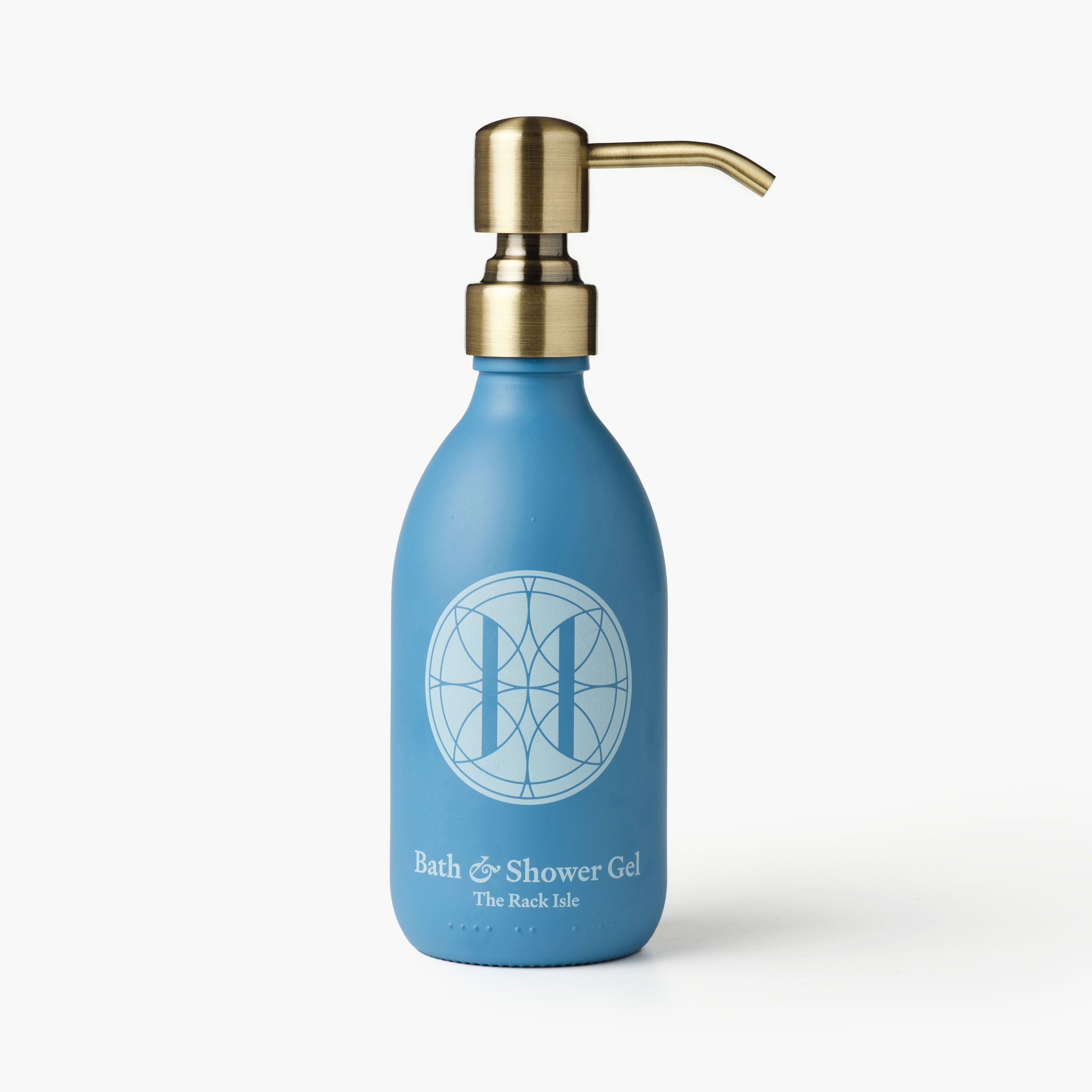Eleven Bibury 'Rack Isle' blue bottle of bath and shower gel with a gold pump on a white background