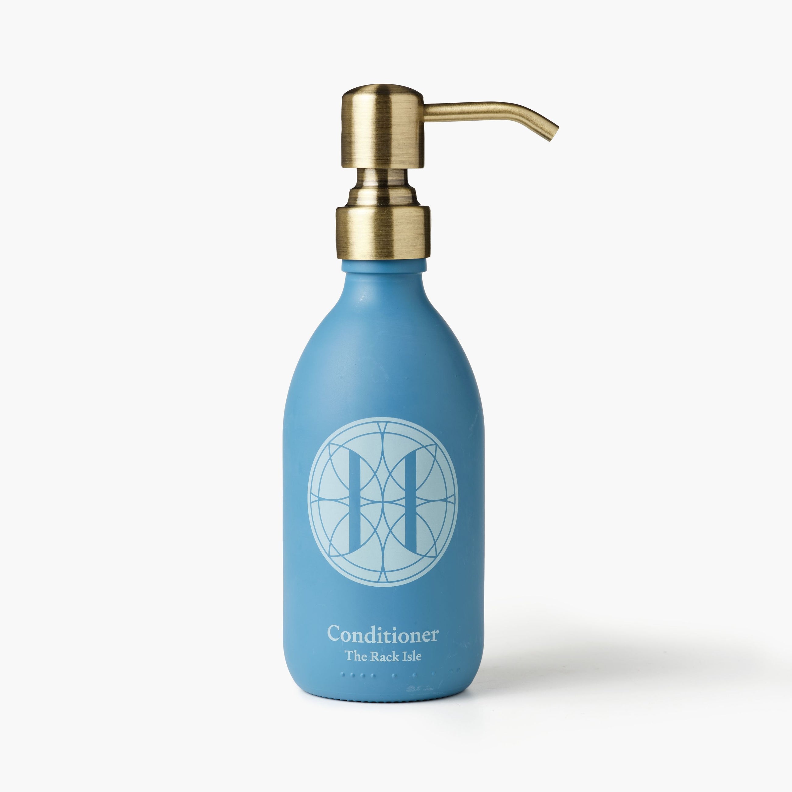 Eleven Bibury 'Rack Isle' blue conditioner bottle with gold pump on a white background.