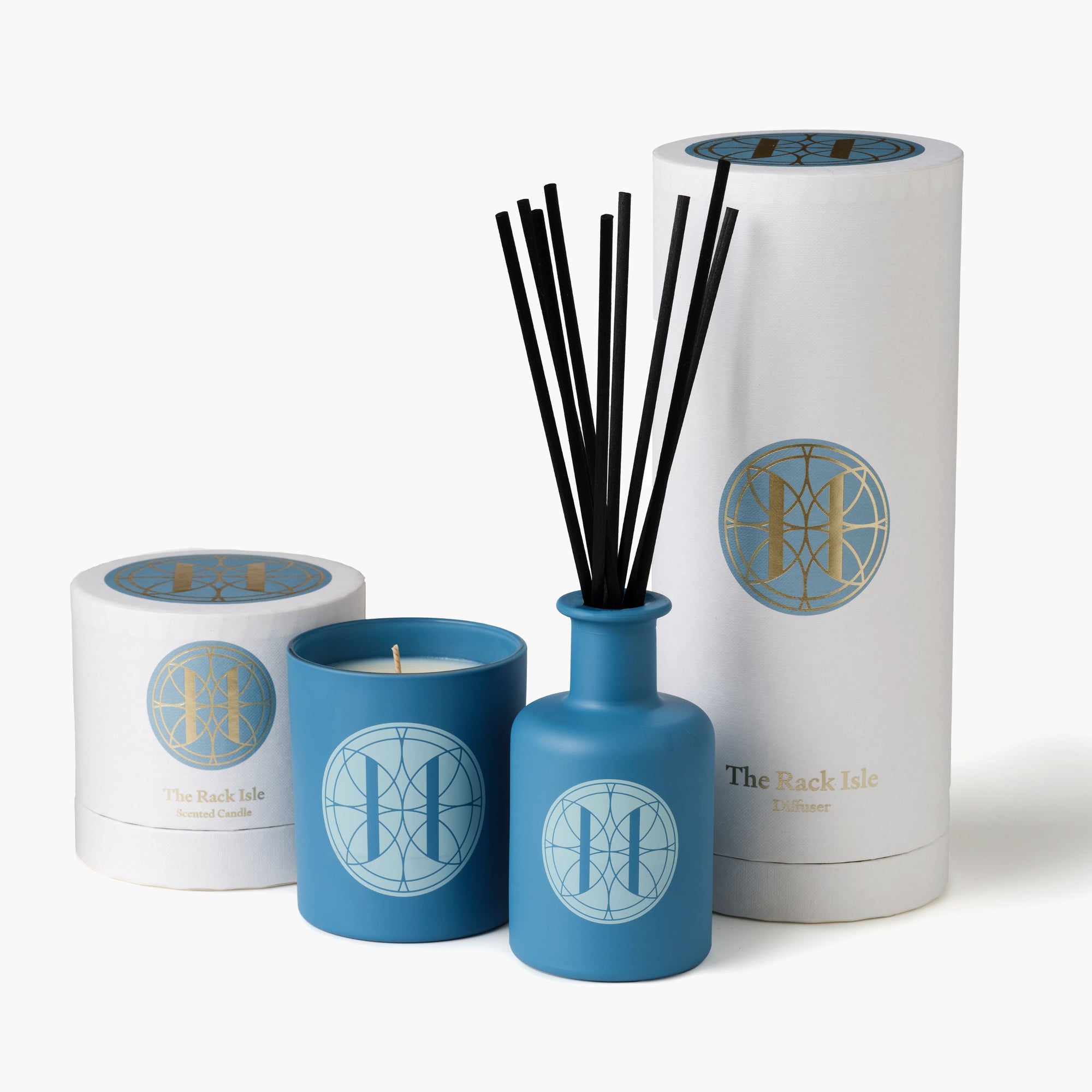 Eleven Bibury 'Rack Isle' candle, diffuser, and packaging with logo on a white background