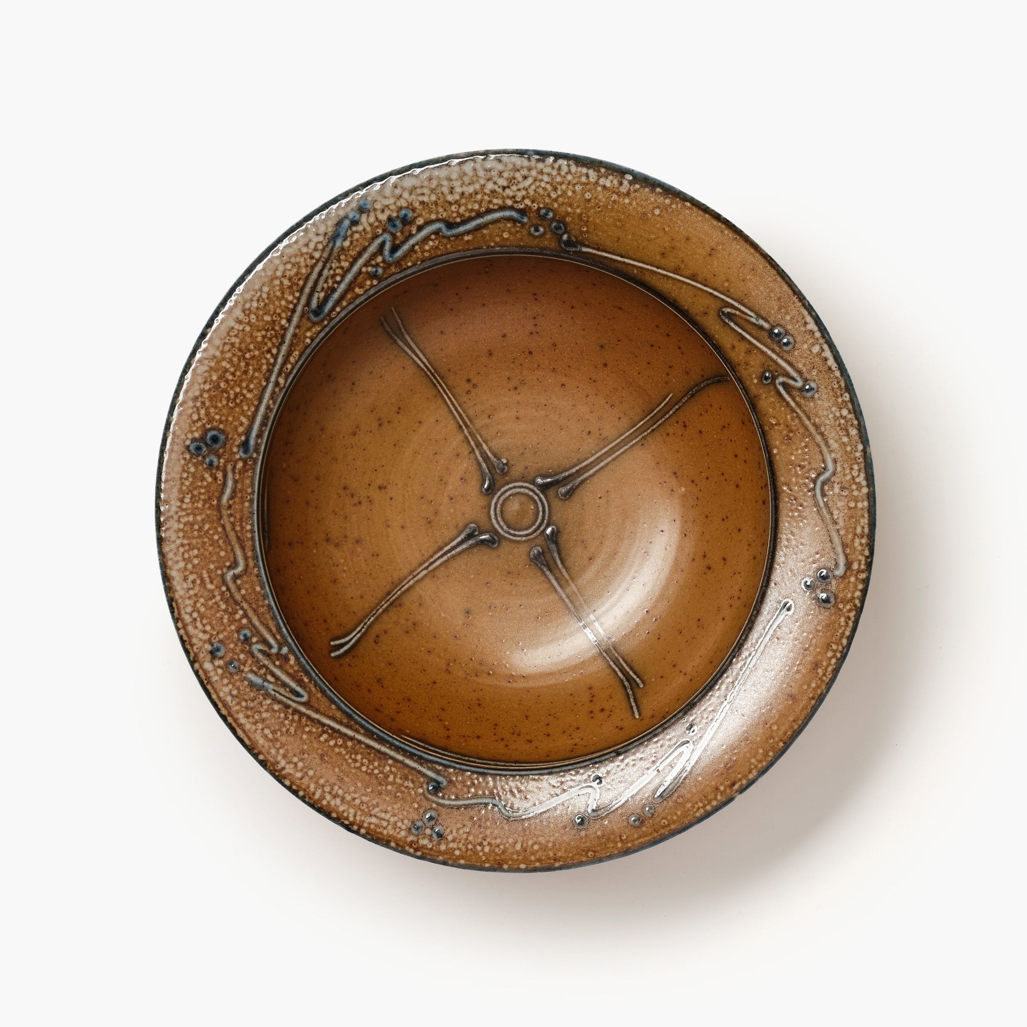 Ceramic bowl with decorative design on a white background