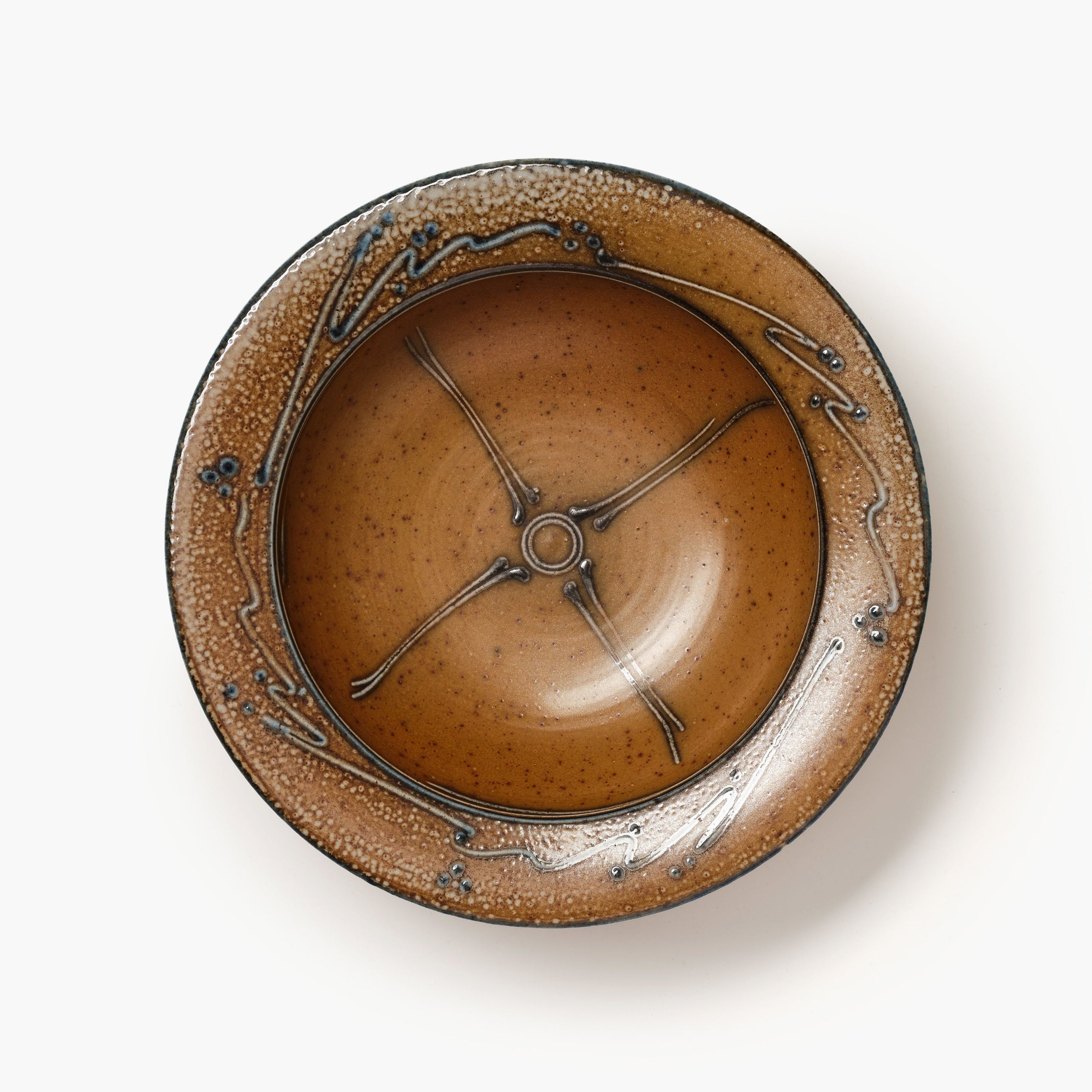 Ceramic bowl with decorative design on a white background