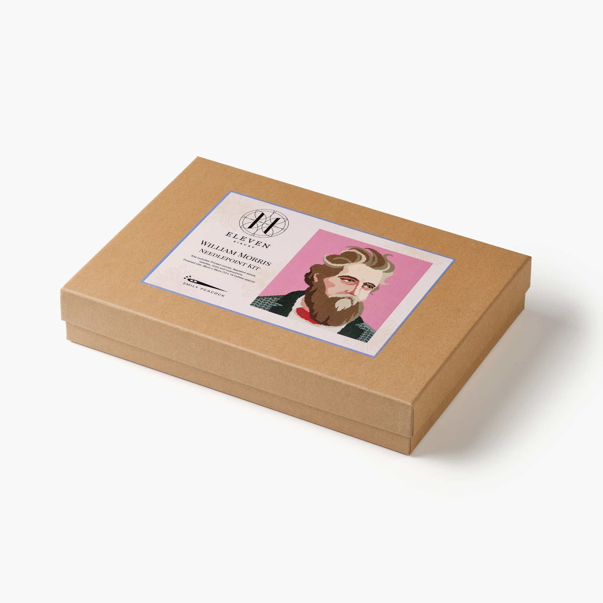 Brown box with a needlepoint kit featuring a William Morris portrait on a white background